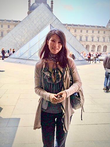 happy gratitude in front of Louvre Museum.