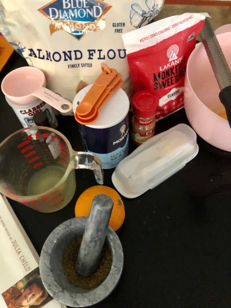 Baking tool essentials include measuring glass, teaspoons, and measuring cups.