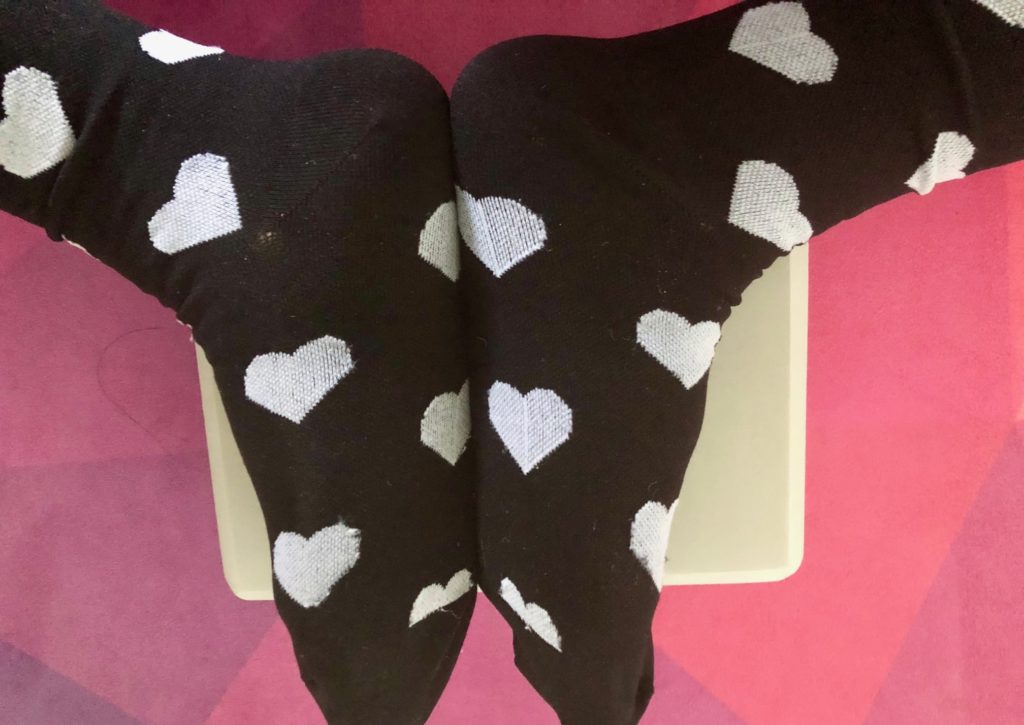 yoga side benefits are more than just the obvious health and wellness. You can have a reason to wear a fun pair of seasonal socks like this heart pair.