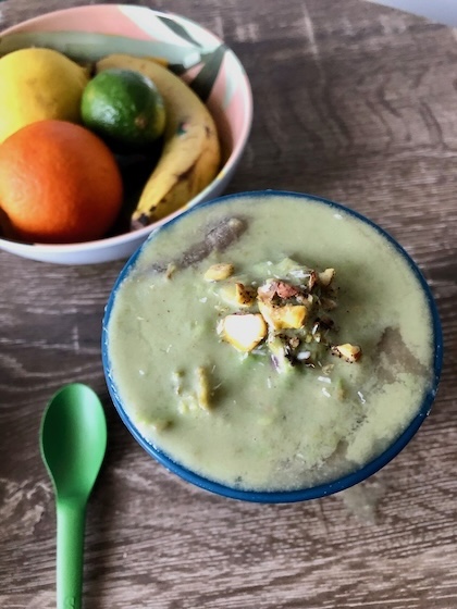 An avocado smoothie with coffee and milk to start the breakfast.