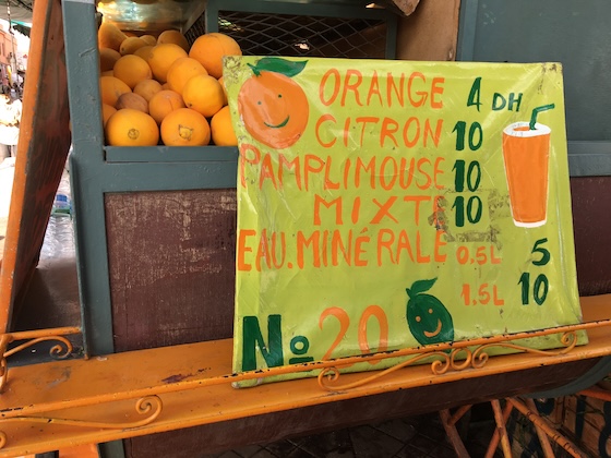 Sign for fresh orange, citron, pamplimouse, mixte, and eau minerale stand.