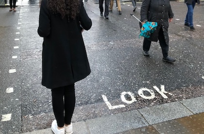 London "Look" message painted on the pavement are like "mind the gap" messages in the Underground.