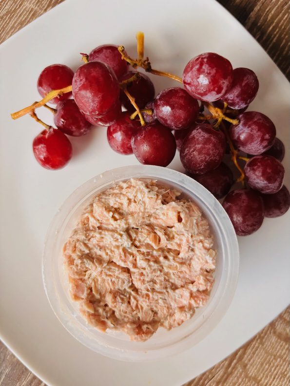 salmon salad on the side in a cup.