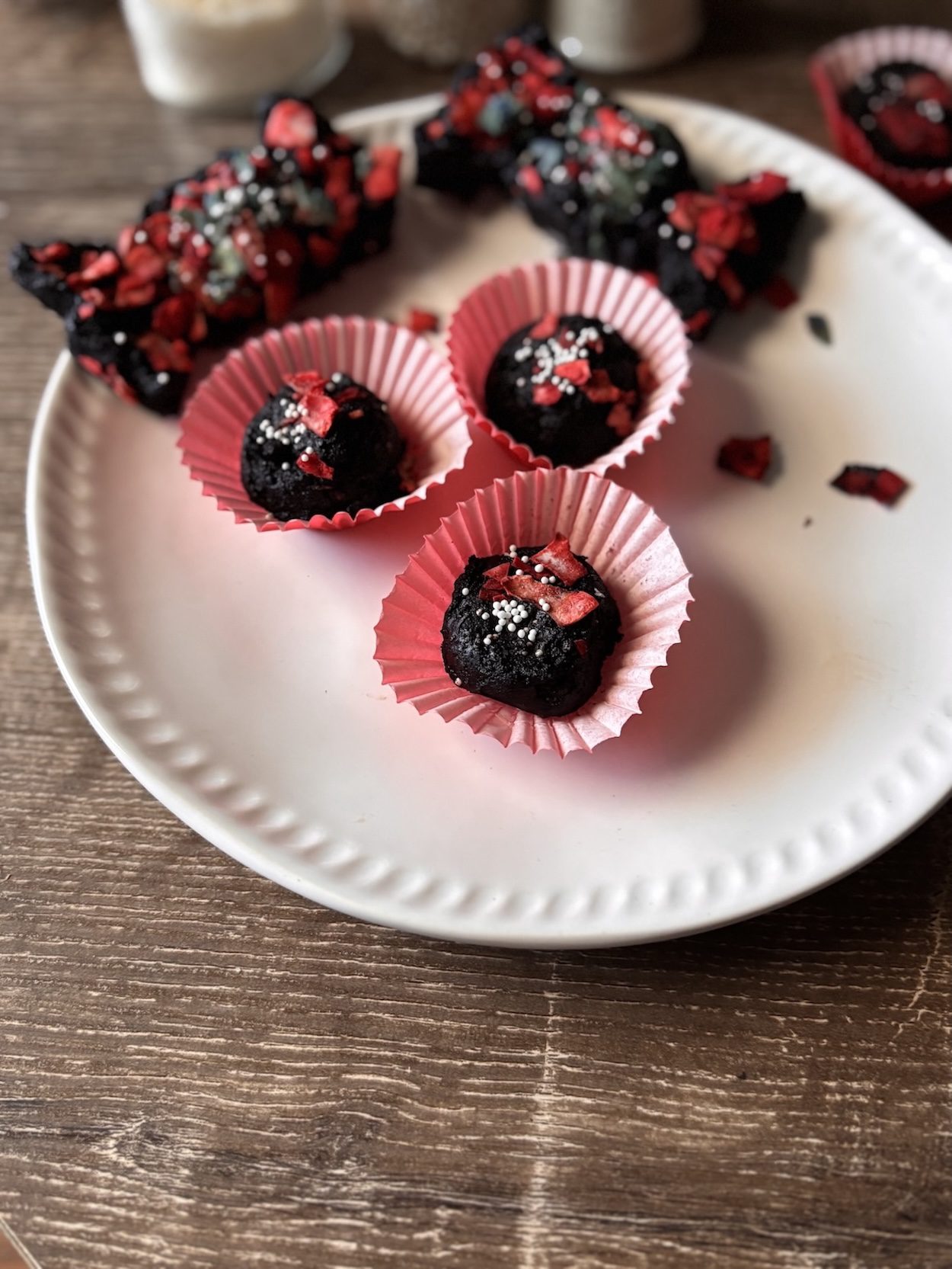 Dark cocoa cookie that are no-bake balls and candy bow shape.