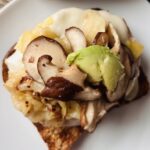 fermented cabbage on an open faced plant-based sandwich.