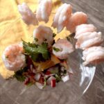 Ceviche with shrimp served in a martini glass.