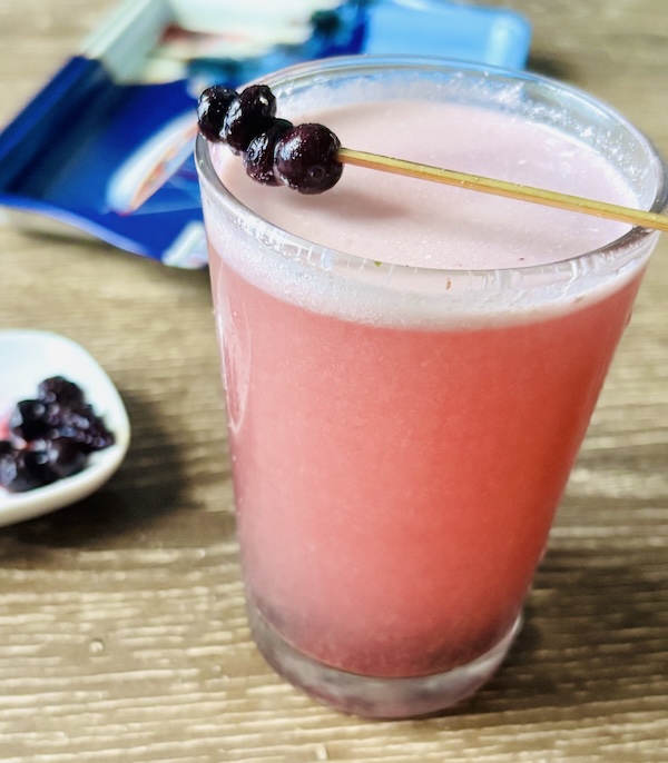 Dirty soda with blueberry tea and wild blueberries.