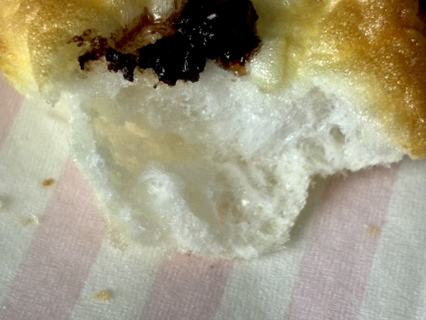 The meringue cookie inside after it has been double baked.