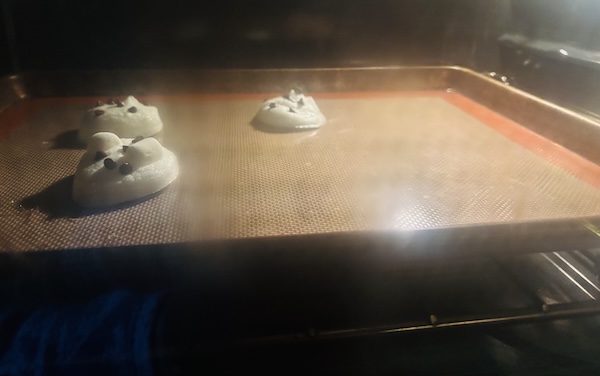 Meringue cookie test baking in the oven.