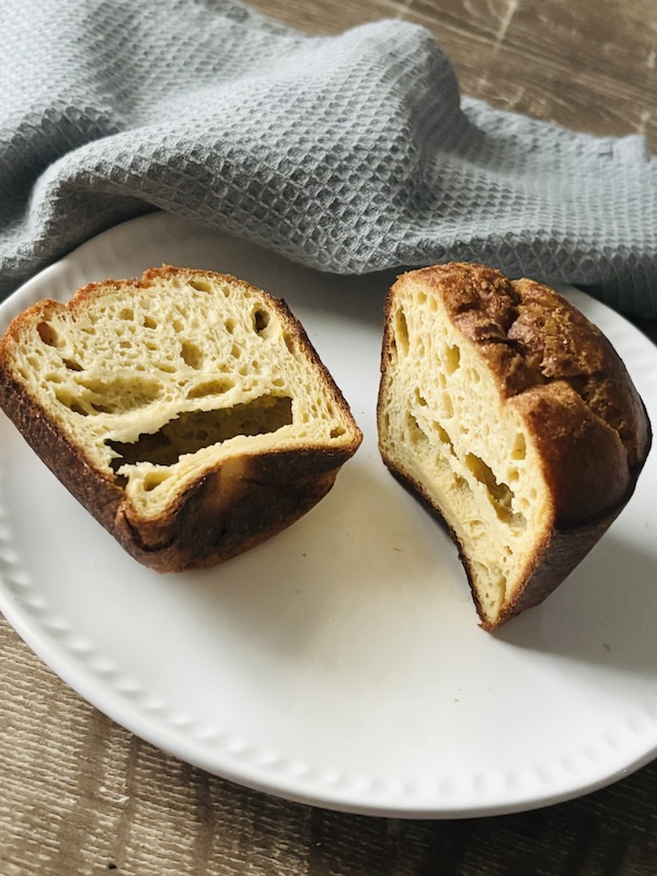 canele pastry muffin has a soft interior with holes.